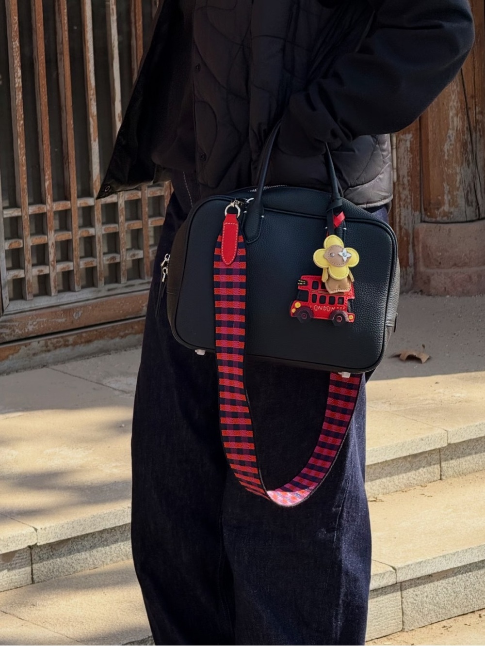 Boutique Black Leather Crossbody Bag with Red Accent Strap